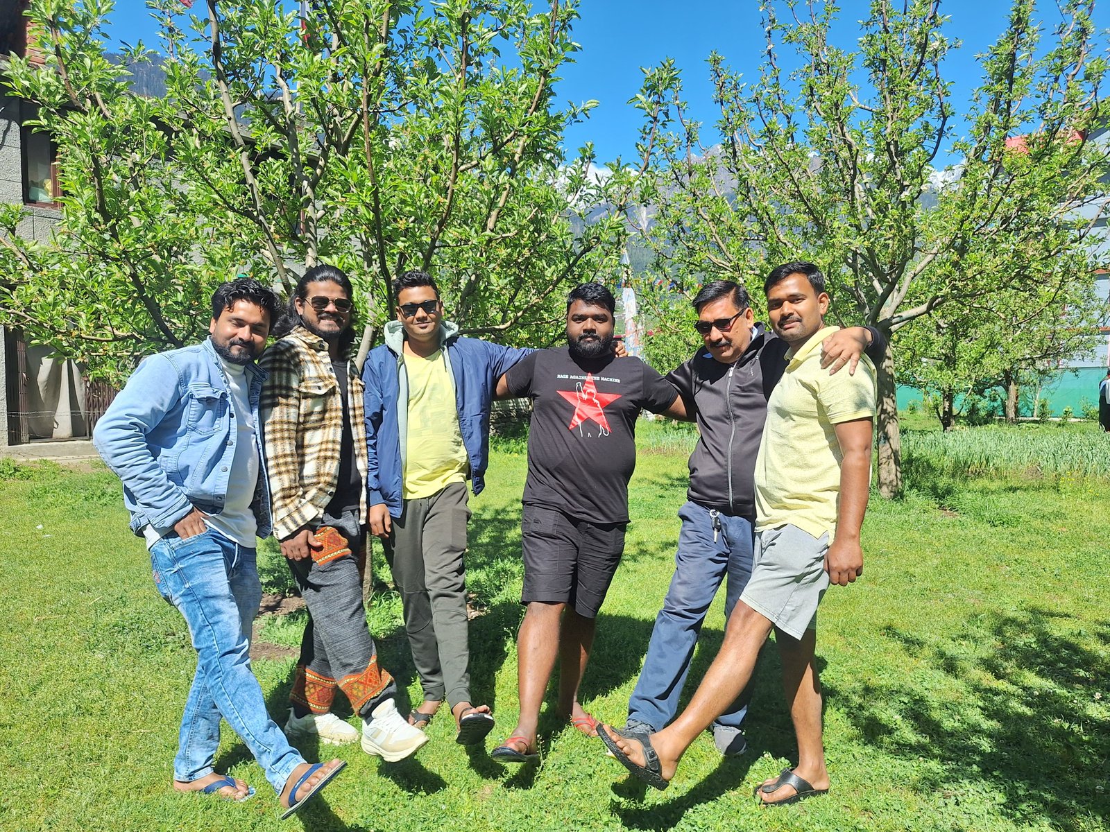 A group of guests enjoying the orchard grounds at BTH Hotels & Resorts