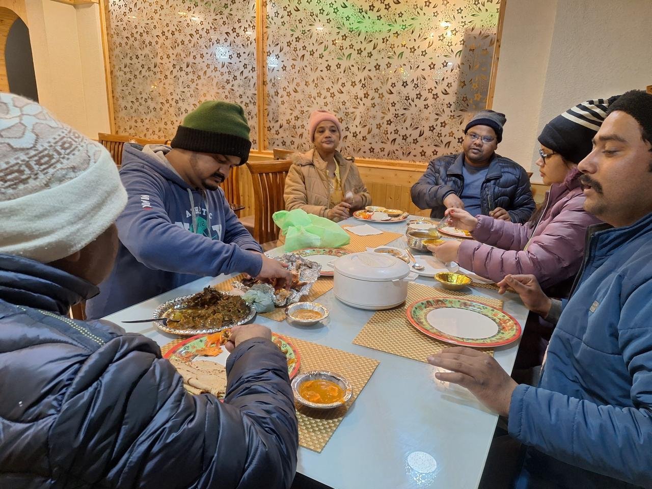 Guests sharing a meal together at BTH Hotels & Resorts