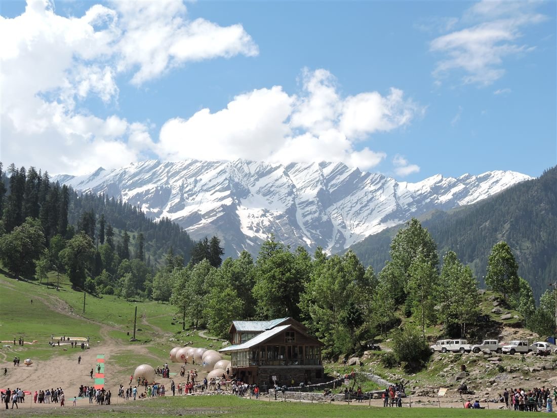 Solang Valley near Manali, with snow-capped peaks and green meadows